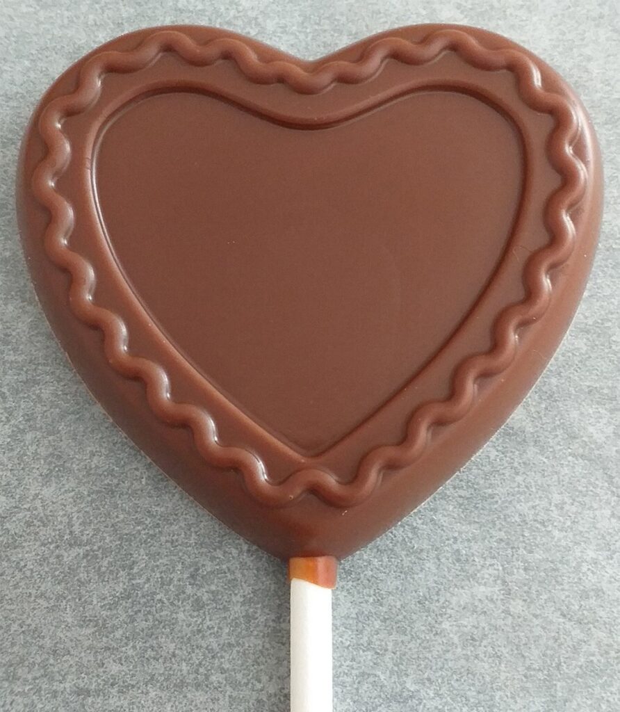 1 SUCETTE COEUR GIRLY en chocolat ALTERNATIVE au lait (sans lait) BIO vegan sans allergènes Exquidia : 20g
